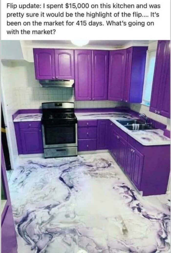 A massive design fail in a house flip featuring vibrant, royal purple cabinets and a matching purple-and-white marbled epoxy floor and countertop. This aggressive questionable home decor has reportedly left the property sitting on the market for over 415 days.