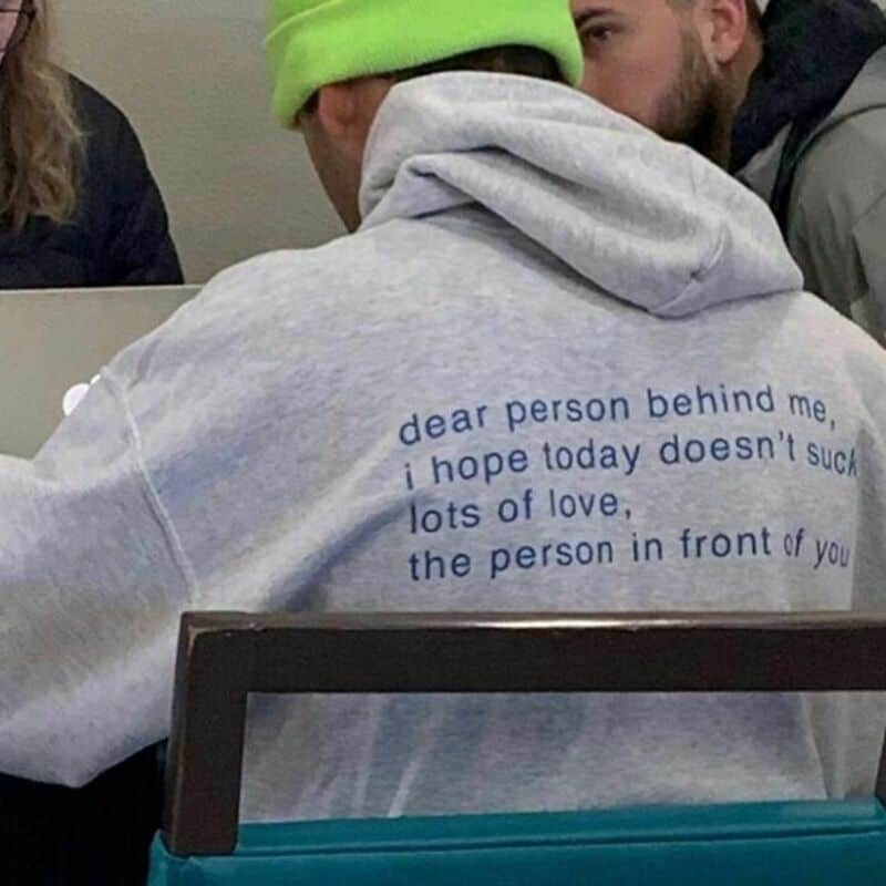 Gray hoodie in classroom reads dear person behind me I hope today doesn't suck lots of love