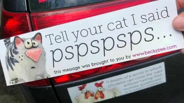 A funny bumper sticker with red and yellow 3D-style block lettering on a black background that reads GREAT MINDS OVERTHINK ALIKE.