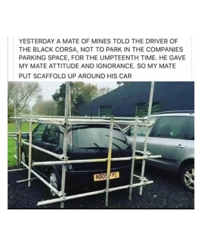 Black Vauxhall Corsa illegally parked in company space completely enclosed by scaffolding poles as revenge