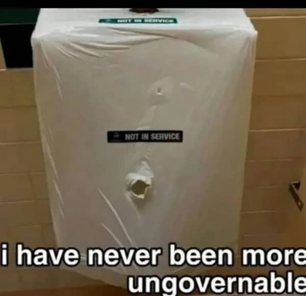 A funny image of a hand sanitizer dispenser wrapped in plastic with a hole poked through it.