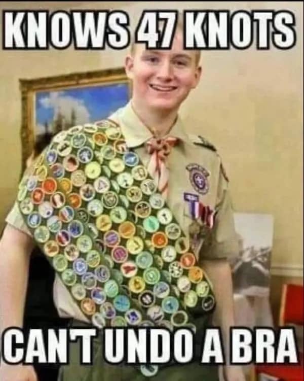 Classic meme of a Boy Scout with many badges who cannot undo a bra.