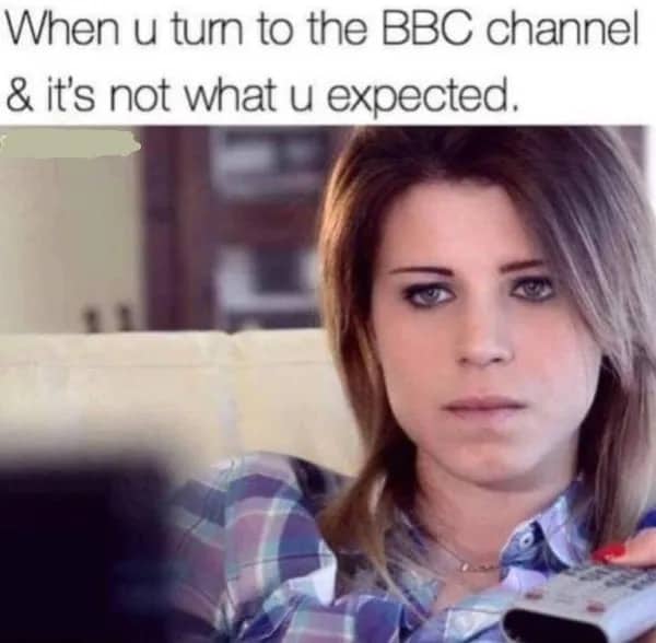 Woman holding a TV remote with a confused expression and a suggestive joke about the BBC channel.