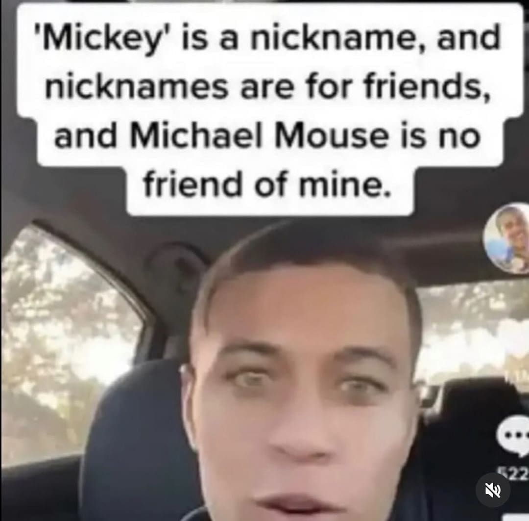 Close-up of a man's face with text jokingly referring to Mickey Mouse as Michael Mouse.
