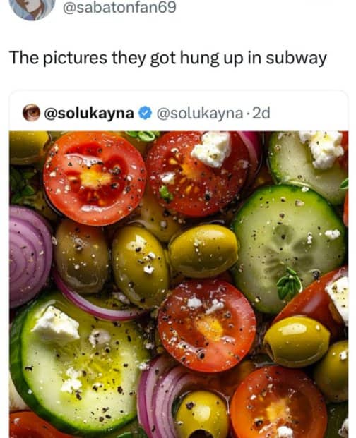 High quality close up of a fresh Mediterranean salad with tomatoes, cucumbers, olives, and feta.
