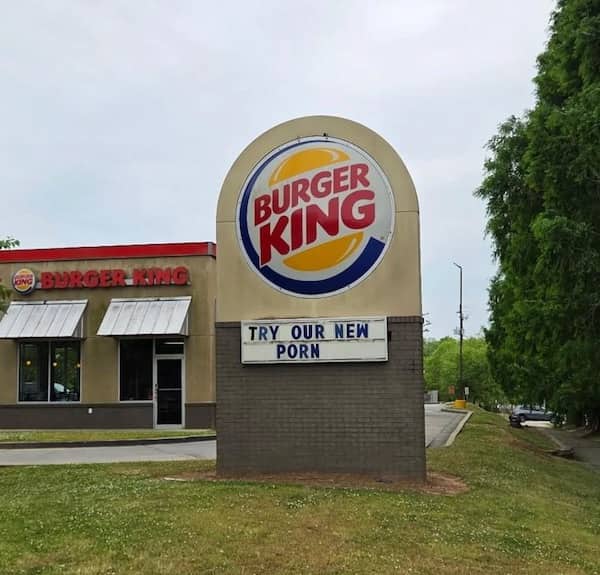 Burger King restaurant sign with a hilarious marquee mishap reading Try Our New Porn.
