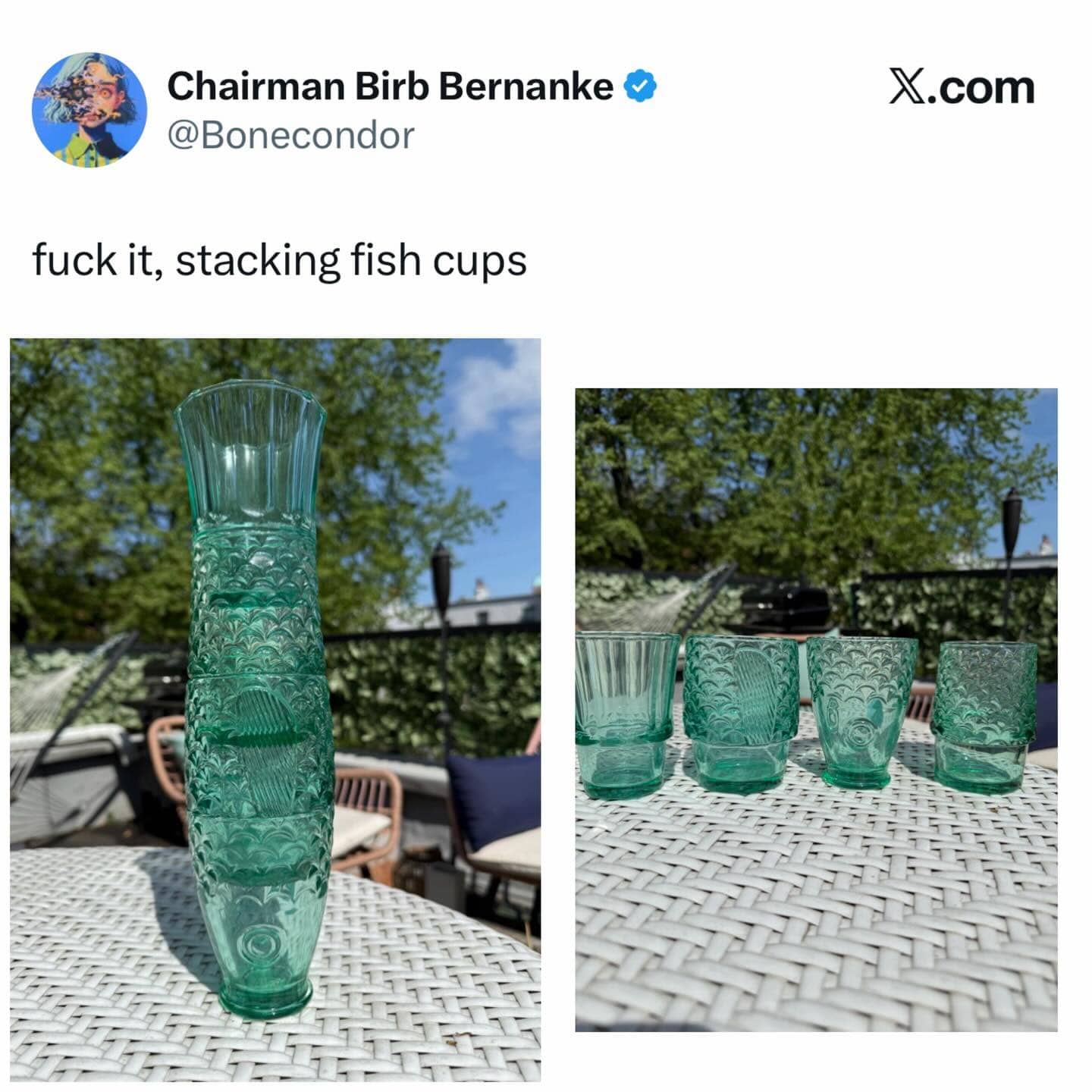 Stackable green glass cups designed to look like a fish when placed on top of each other.