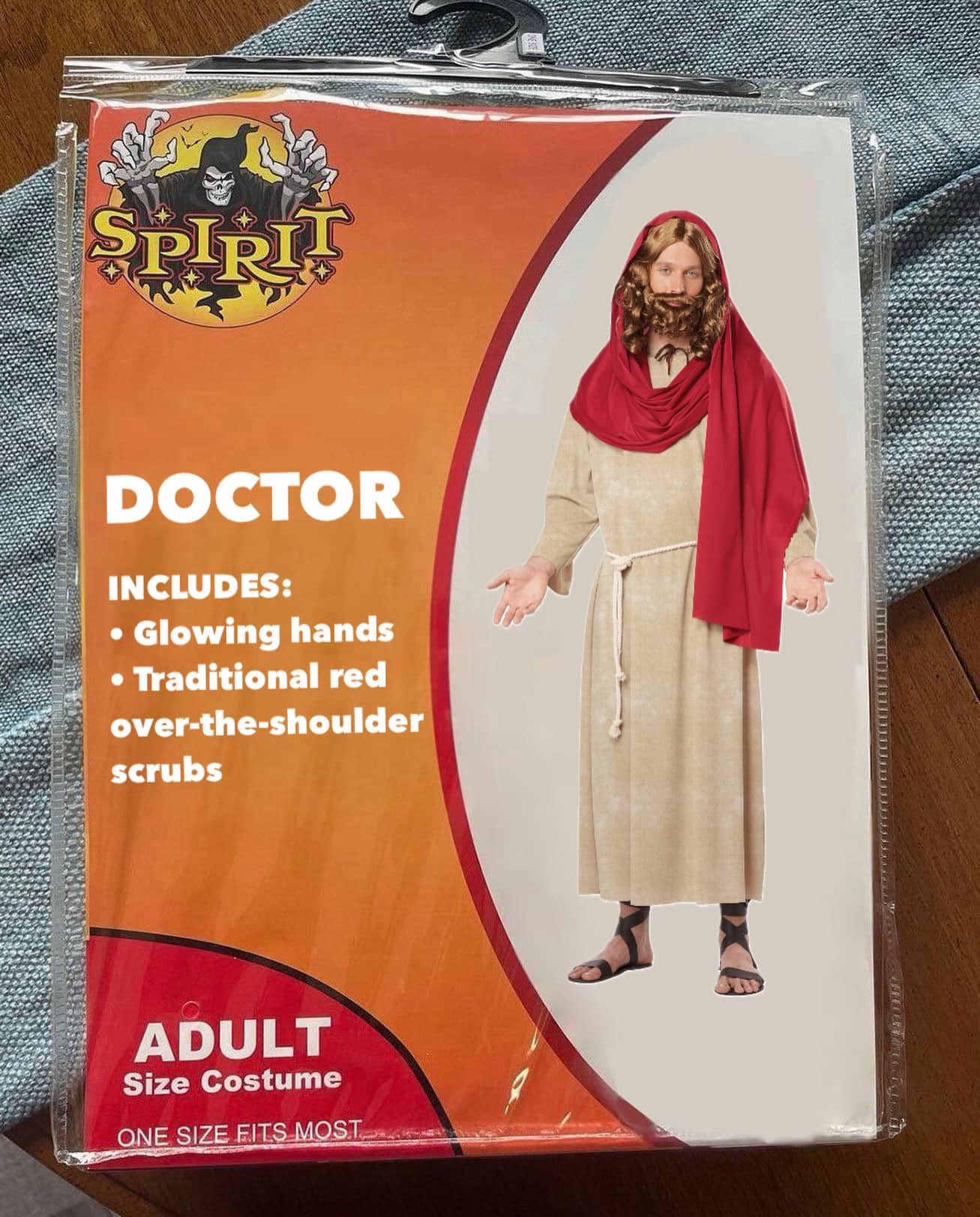 Spirit Halloween costume packaging for a Doctor featuring a man in ancient robes and sandals.