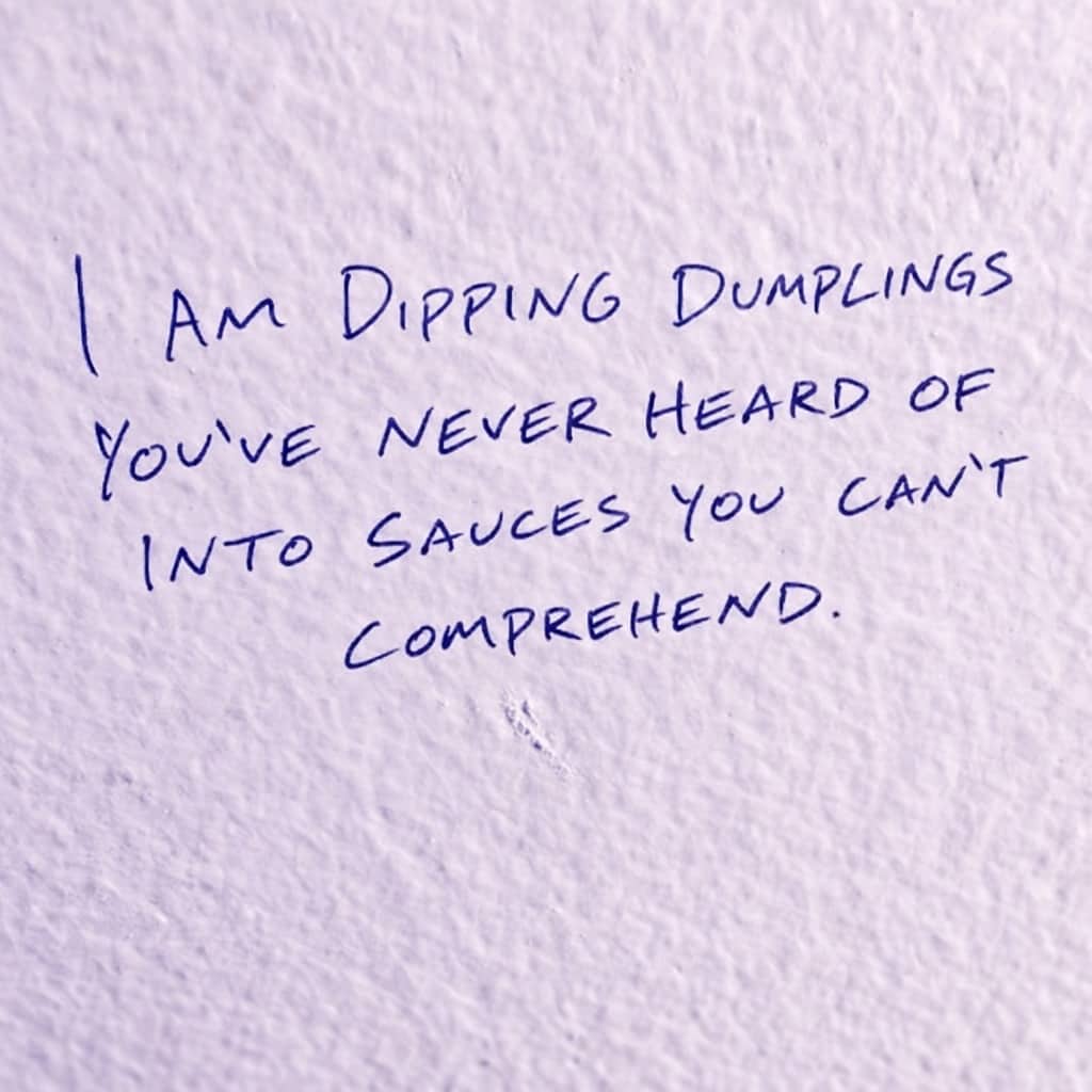 Handwritten note about dipping unknown dumplings into incomprehensible sauces on a textured purple background.