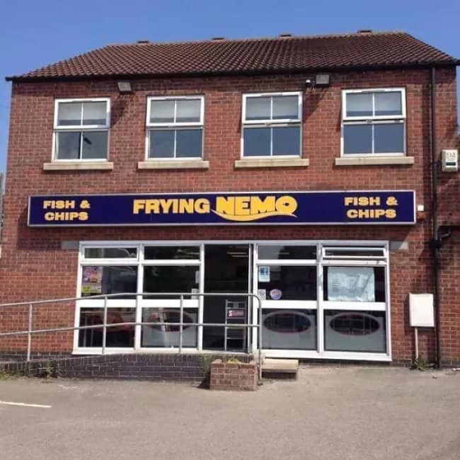 Frying Nemo fish and chips shop with brick building and Disney-inspired Pixar parody signage.