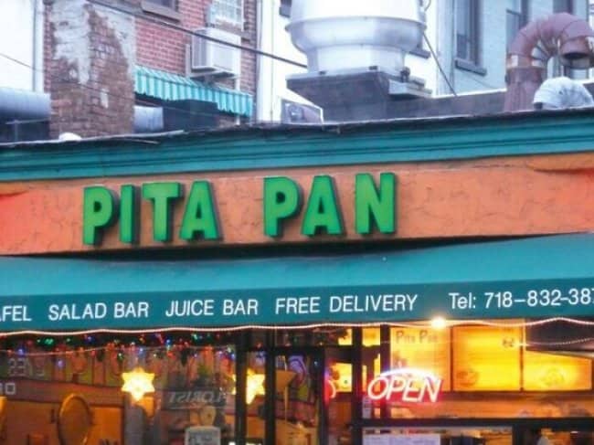 Pita Pan falafel restaurant with green signage, salad and juice bar, Peter Pan inspired name.