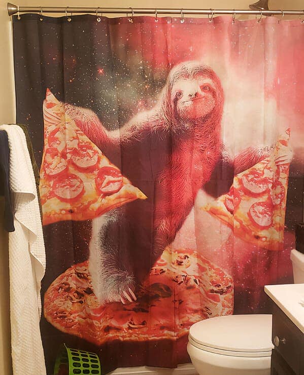 funny shower curtain featuring a majestic sloth floating through a vibrant pink and purple nebula in deep space. The sloth is triumphantly surfing on a giant pepperoni pizza while holding two individual slices like delicious edible wings.