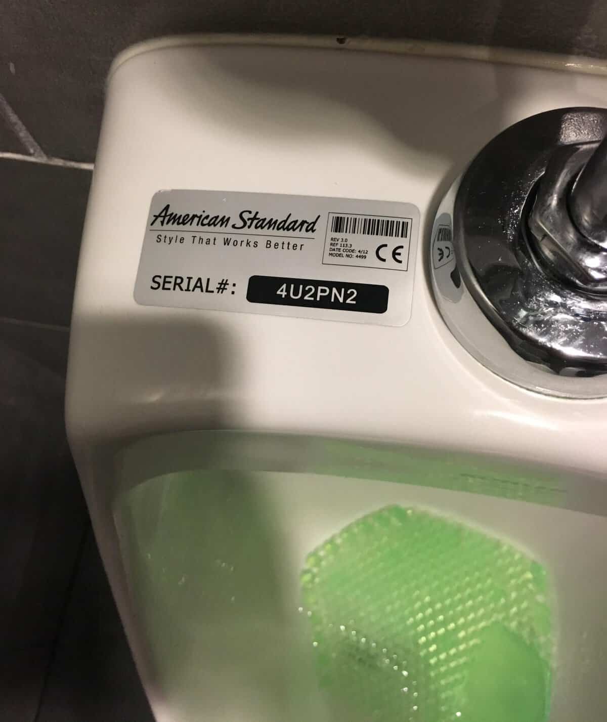 American Standard urinal with serial number 4U2PN2 reading as for you to pee in too