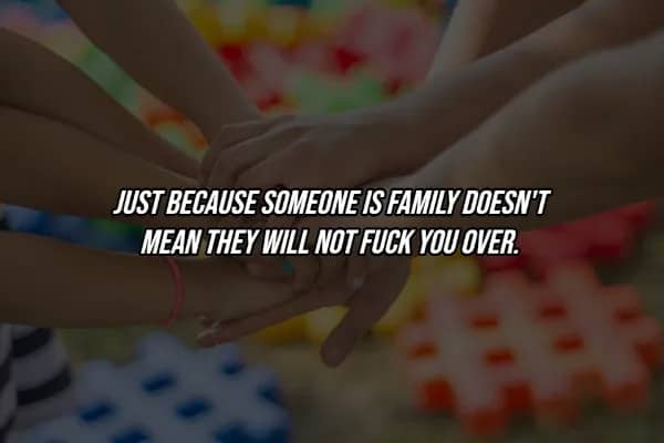 Children's hands stacked together with hard life lesson quote warning that family members can still betray you