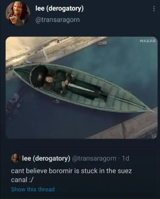 topical lotr meme from Lee (@transaragorn) showing a satellite view of the Suez Canal. Photoshopped into the canal is Boromir's funeral boat, perfectly wedged sideways like the Ever Given ship. The caption reads: "cant believe boromir is stuck in the suez canal :/"