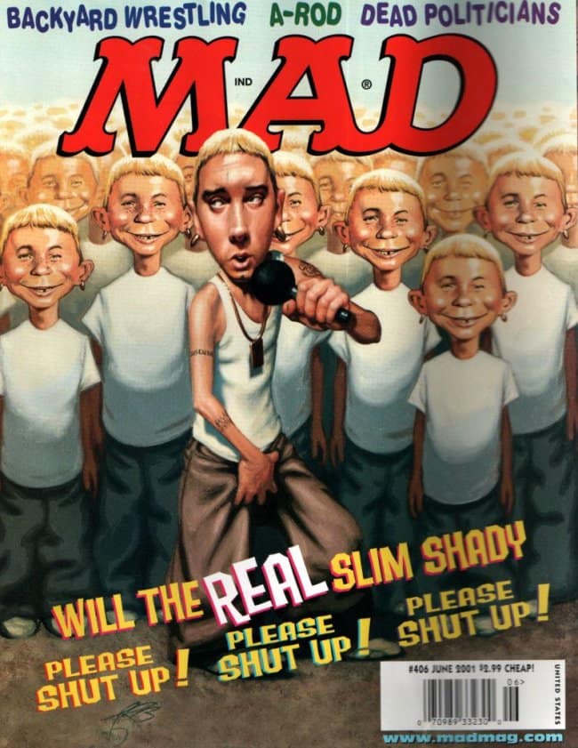 A 2001 vintage mad magazine cover spoofing Eminem's "The Real Slim Shady." Caricature Eminem holds a microphone at center stage, surrounded by an endless sea of Alfred E. Neuman clones all sporting bleached blonde hair and white t-shirts.
