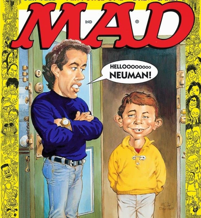 A classic crossover vintage mad magazine cover featuring a caricature of Jerry Seinfeld leaning against a doorway with his arms crossed. He looks down in annoyance at Alfred E. Neuman, who is dressed as the iconic postman Newman, while a speech bubble reads: "HELLOOOOOOOO NEUMAN!"