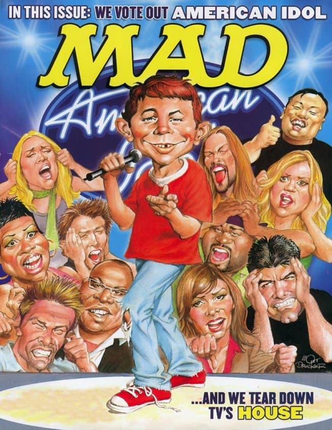 A star-studded vintage mad magazine cover lampooning American Idol. Alfred E. Neuman stands center stage with a microphone and a smug grin while the show's judges and contestants look on with expressions of pure horror, agony, and disbelief.