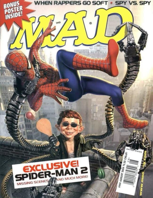 An action-packed vintage mad magazine cover from August 2004 parodying Spider-Man 2. Spider-Man is seen tangled in Doctor Octopus's mechanical arms, while Alfred E. Neuman, wearing Doc Ock's sunglasses, plays with a wooden paddleball in the foreground.