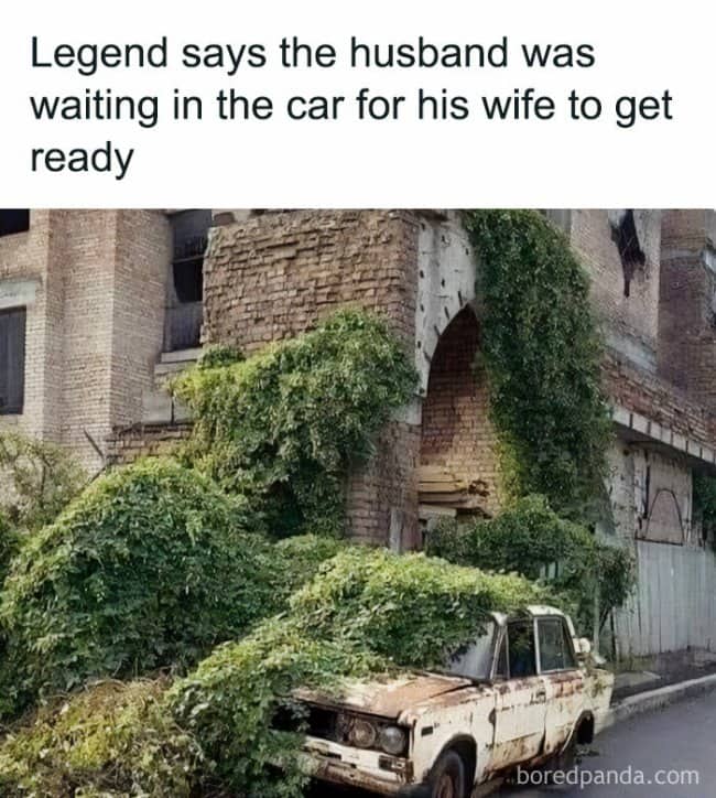 Completely overgrown rusted abandoned car meme captioned "husband waiting in car for wife to get ready"