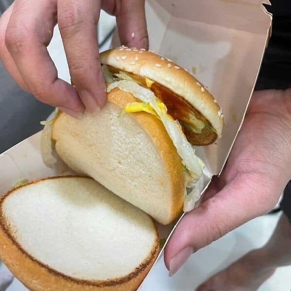Empty McDonald's burger fail with only lettuce and sauce between buns, missing patty entirely