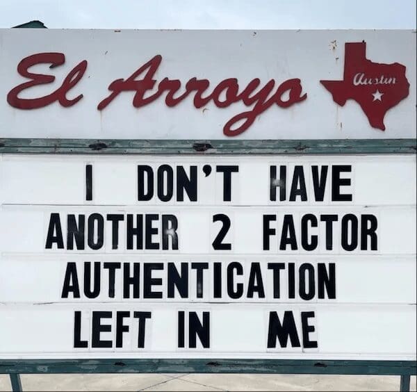 A photograph of the iconic white marquee sign from the El Arroyo restaurant in Austin, Texas. The bold black lettering delivers a punchline about digital burnout: "I DON'T HAVE ANOTHER 2 FACTOR AUTHENTICATION LEFT IN ME."