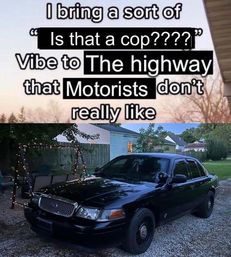 entry from a meme dump featuring a sleek black Ford Crown Victoria parked in a driveway. The text highlights the specific brand of road-rage-adjacent anxiety this car induces: bringing an "Is that a cop????" vibe to the highway that other motorists absolutely despise.