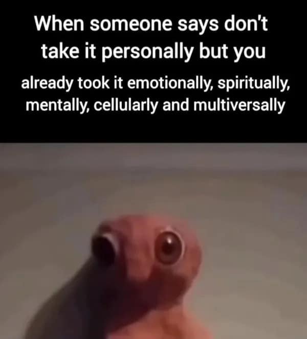 reaction image featuring a wide-eyed, startled pink puppet creature. The caption describes the feeling when someone tells you not to take something personally after you've already taken it "emotionally, spiritually, mentally, cellularly and multiversally."