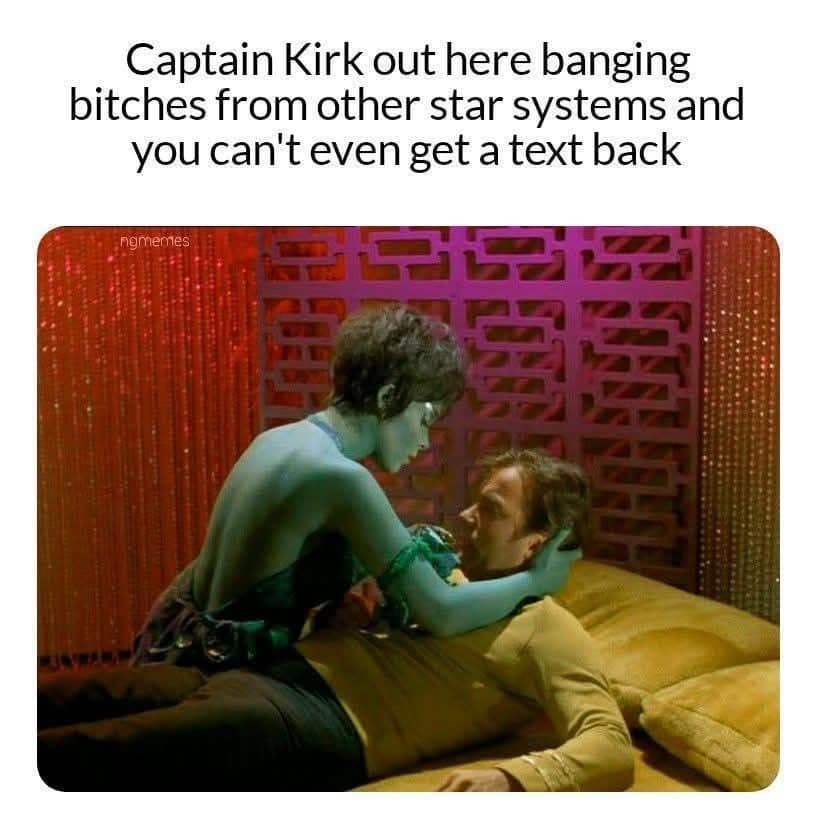 A classic funny meme featuring Captain Kirk from Star Trek in bed with a green-skinned Orion woman. The text above dryly observes that Kirk is successfully dating across the galaxy while the reader can’t even manage to get a text back on Earth.
