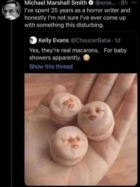 A screenshot of a disturbing tweet from horror author Michael Marshall Smith. The image shows several hyper-realistic macarons shaped like the faces of sleeping human infants, which Smith claims is the most disturbing thing he has ever seen.