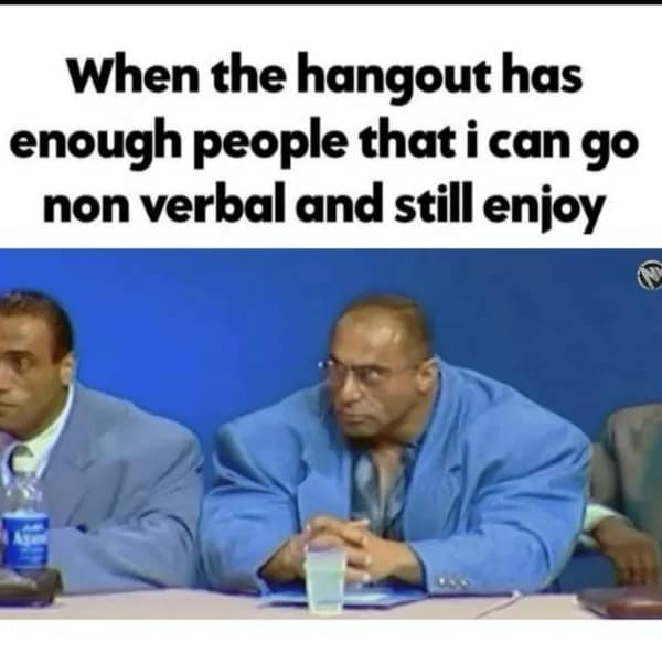 hilarious meme showing a table of incredibly muscular, broad-shouldered bodybuilders in suits, used to represent the relief of an introvert when a hangout has enough people that they can finally "go non-verbal" and just enjoy the vibe.