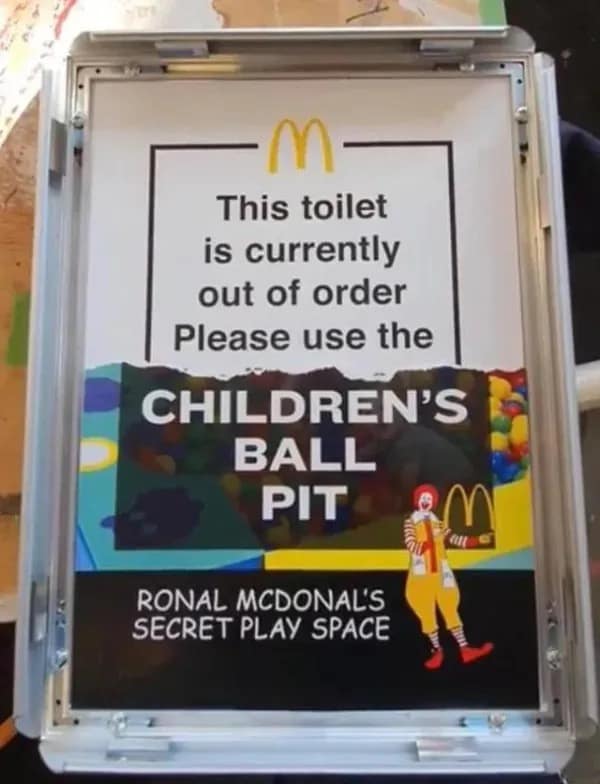 funny meme showing a printed McDonald's sign. The text claims the toilet is out of order and instructs customers to instead use the "CHILDREN'S BALL PIT," which it labels as "RONAL MCDONAL'S SECRET PLAY SPACE."