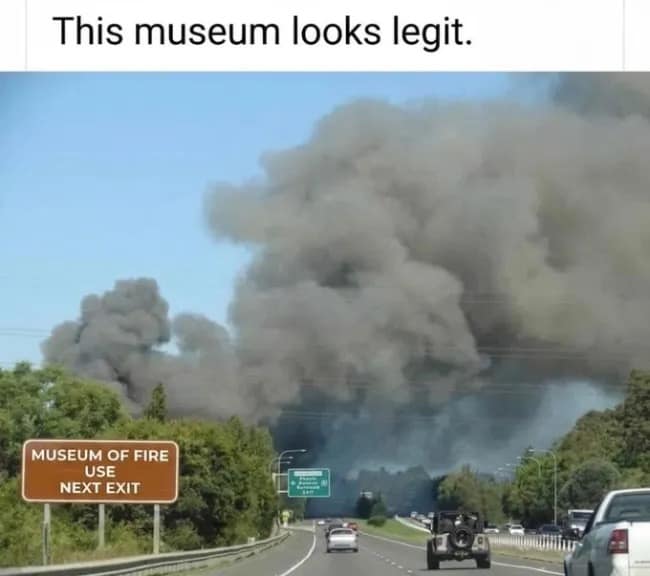 A highway photo included in this meme dump shows a roadside sign for a "Museum of Fire" while a massive, ominous plume of black smoke billows from the forest directly behind it.