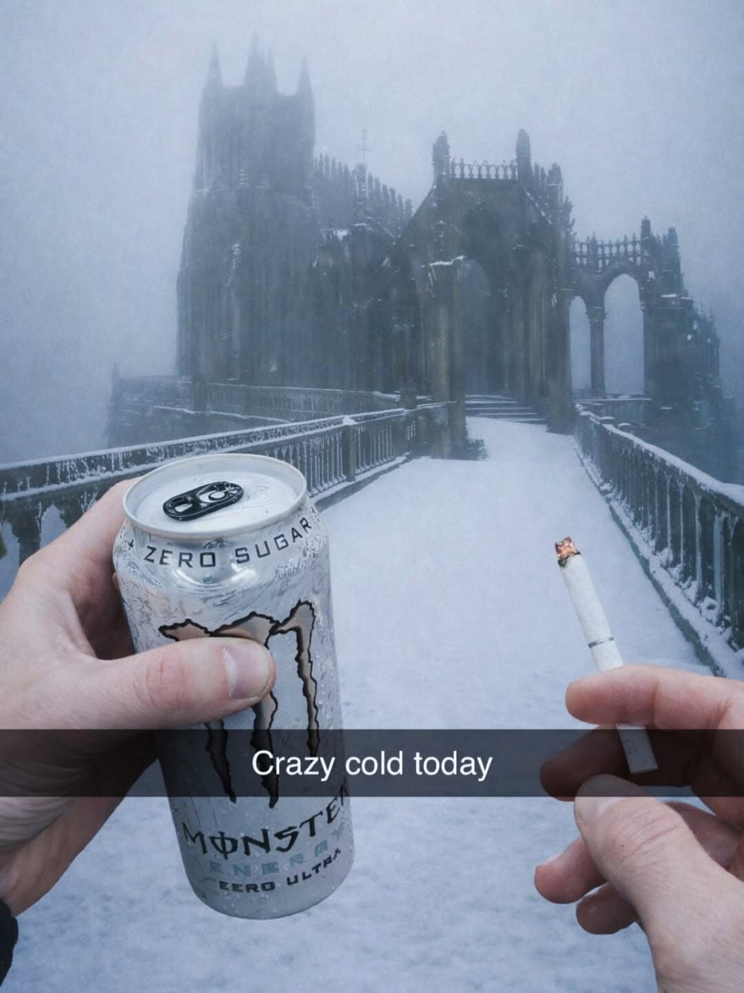 A surreal meme dump first-person photo of someone holding a white "Zero Sugar" Monster Energy can and a lit cigarette in a frozen wasteland. In the background, a massive, snowy gothic cathedral looms, resembling a Dark Souls environment, captioned: "Crazy cold today."