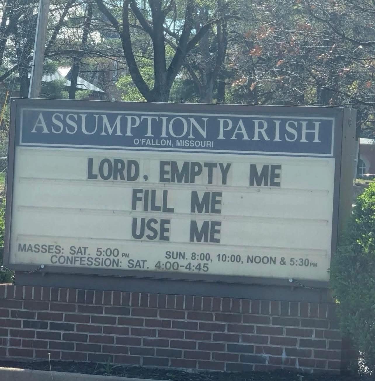 A church sign for Assumption Parish in O'Fallon, Missouri, with a message that reads LORD, EMPTY ME, FILL ME, USE ME. It is a common inclusion in a meme dump because of the unintentional but highly suggestive double entendre.