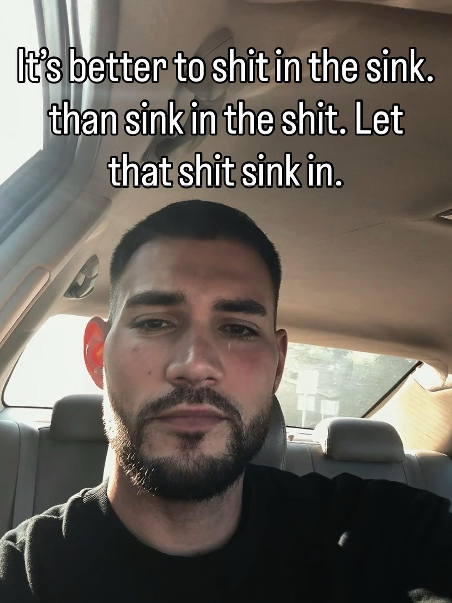 A "deep-thought" hilarious meme featuring a man in a car looking seriously into the camera. The text provides a nonsensical, rhythmic piece of "wisdom": "It’s better to shit in the sink. than sink in the shit. Let that shit sink in."