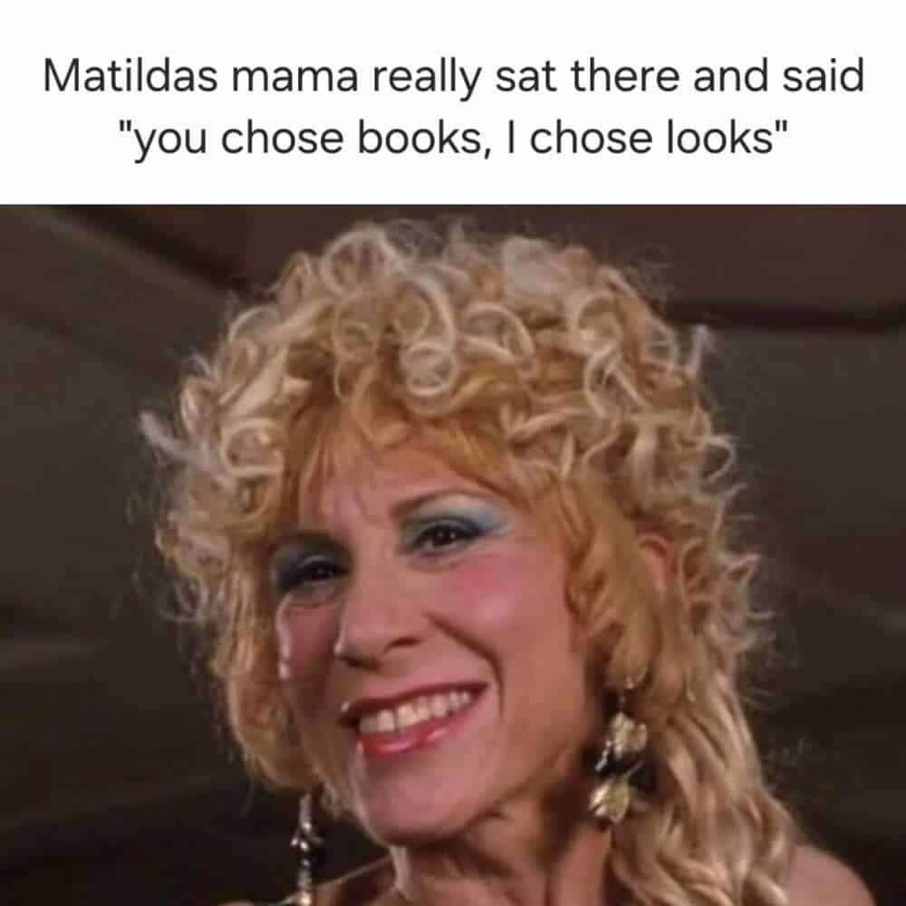 A millennial meme featuring Danny DeVito's Zinnia Wormwood from Matilda, sporting peak 90s bleached curls and vibrant makeup. The text mocks her infamous line: "you chose books, I chose looks," reminding millennials of the chaotic adults they grew up with.