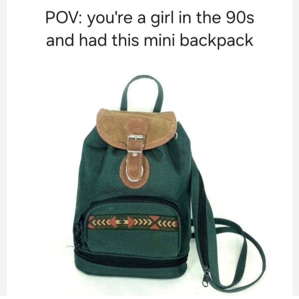 A green canvas mini backpack with a brown suede flap and a small southwestern-patterned pocket is the focus of this millennial meme. The caption labels it as the definitive Point of View for any girl growing up in the 90s.