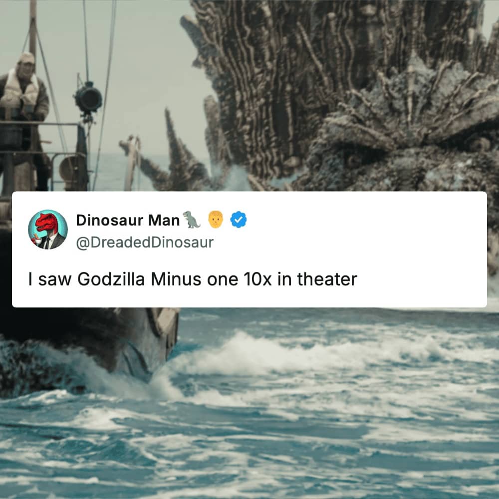 Godzilla Minus One scene shows the monster in the ocean near a boat with caption.