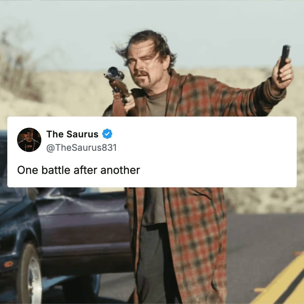 Leonardo DiCaprio in Once Upon a Time in Hollywood holding a rifle during movie battles.