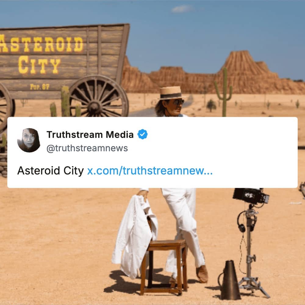Wes Anderson's Asteroid City set featuring a desert landscape and a wooden wagon prop.