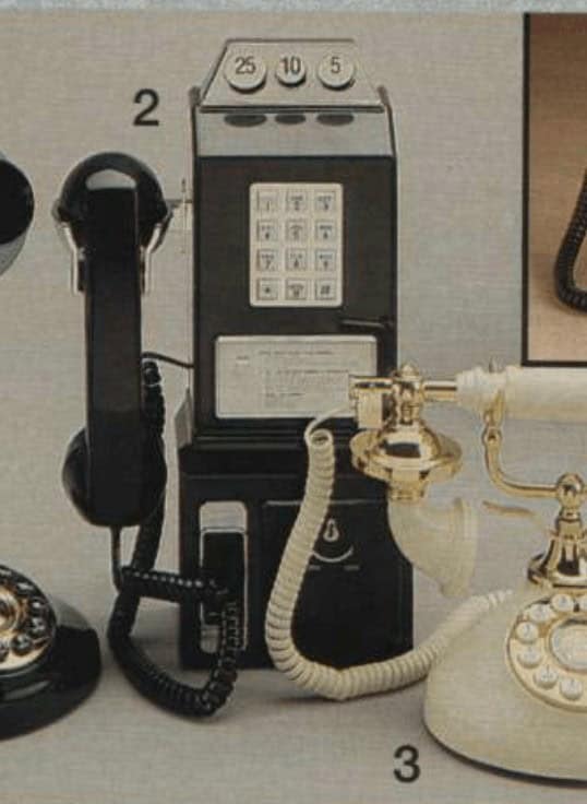 A professional vintage landline phone lineup featuring a black payphone-style unit with a silver keypad and coin slots at the top. Next to it sits a classic cream-colored rotary phone with ornate gold detailing on the cradle and handset.