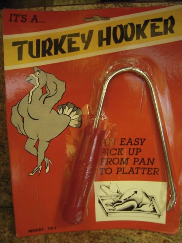 Vintage kitchen tool called Turkey Hooker packaged with illustrated turkey wearing high heels on red background