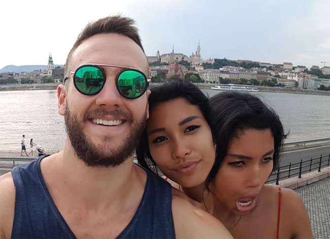 : A selfie with a panorama glitch creating a second distorted face for a woman.