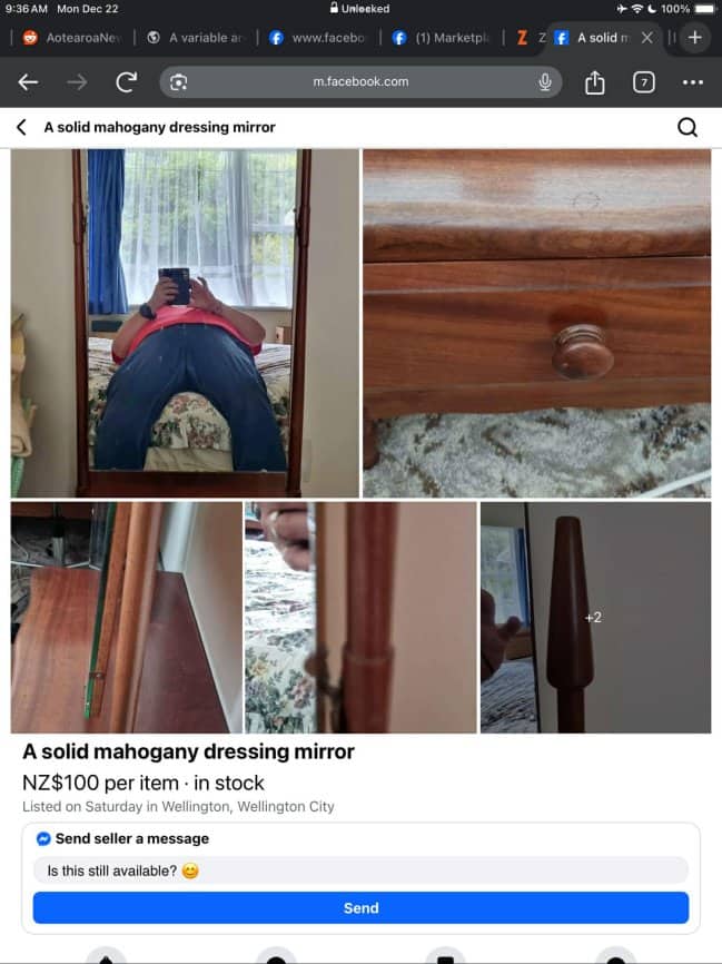 Tall mahogany dressing mirror for sale reflecting seller with head obscured and crotch visibl