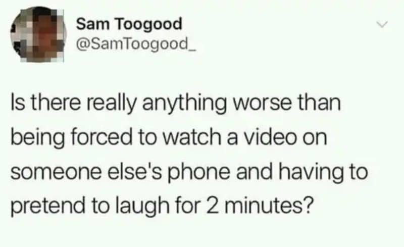 Relatable tweet about the social torture of watching a video on someone else's phone and forced laughter.