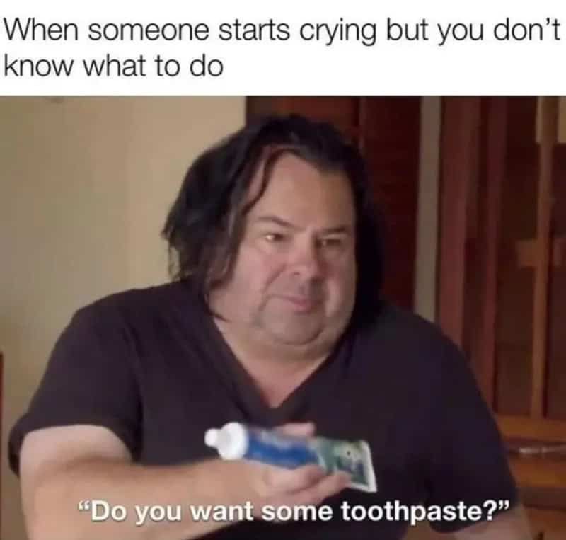 Confused man offering toothpaste meme when you don't know how to comfort someone crying.