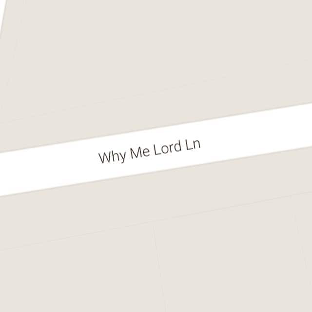 Map showing narrow residential street bluntly named Why Me Lord Ln on tan background.