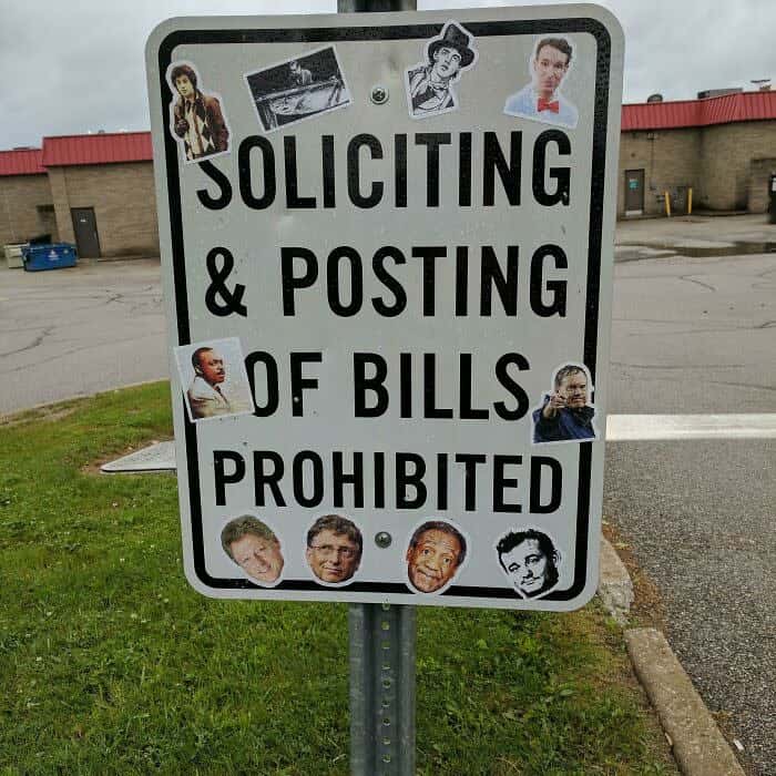 No soliciting sign covered in sticker photos of famous people all named Bill