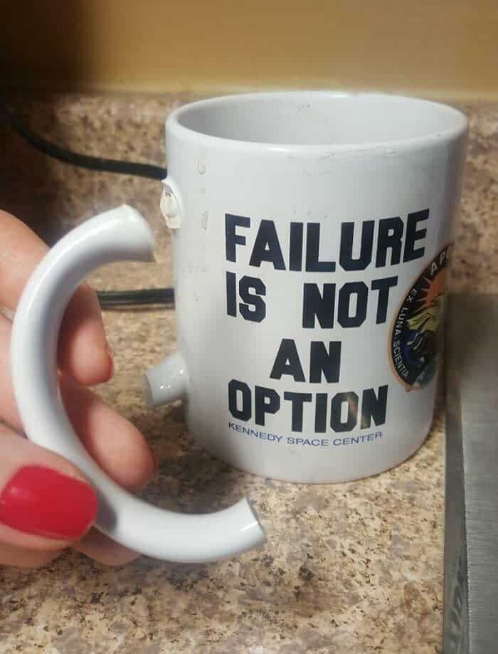 roken handled Kennedy Space Center mug reading failure is not an option held together